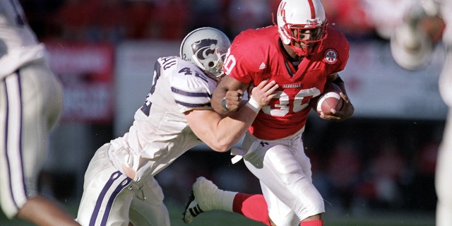 Dahrran Diedrick carries the ball during a football game