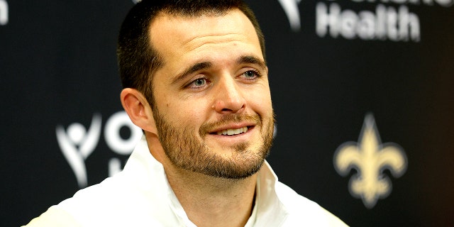 Derek Carr speaks to reporters