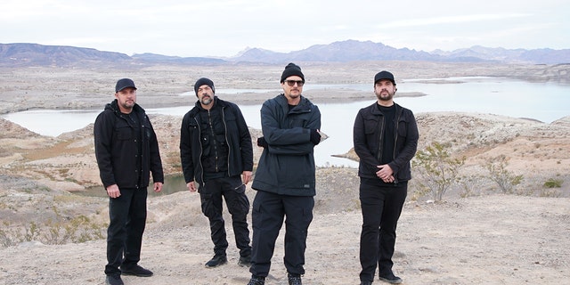 Group photo of Zak Bagans paranormal investigation team in front of Lake Mead.
