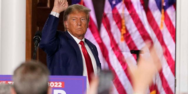 Former President Donald Trump gestures after speaking at Trump National Golf Club in Bedminster