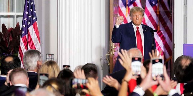 Donald Trump motions after speaking to supporters at Trump National Golf Club Bedminster