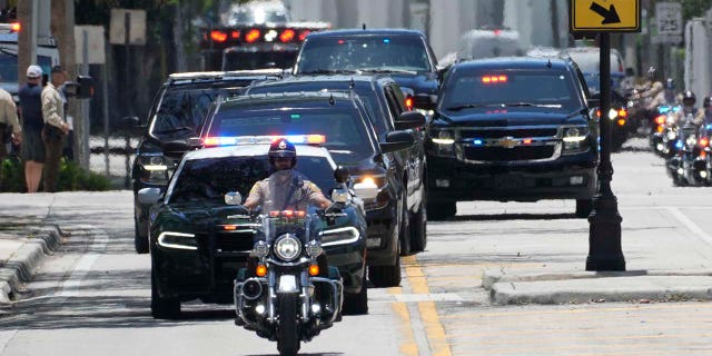 The motorcade for former US President Donald Trump arrives to the Wilkie D. Ferguson Jr. United States Courthouse