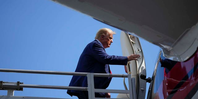 Donald Trump boards his personal plane