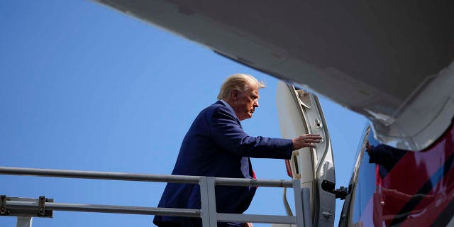 Donald Trump boards his personal plane