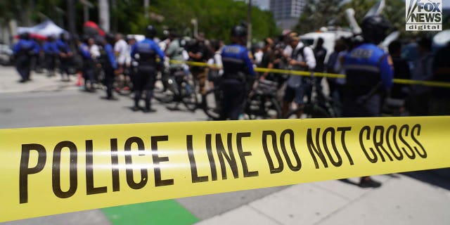 City of Miami Police move media behind police tape