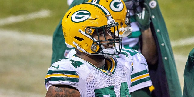 Elgton Jenkins with helmet on sideline