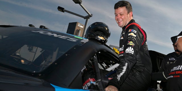 Erik Jones gets out of car