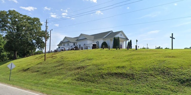 First Baptist Gowensville on top of hill seen from street
