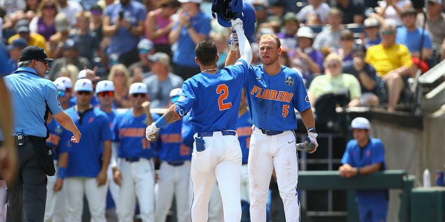 Ty Evans greeted by Ben Nippolt after grand slam