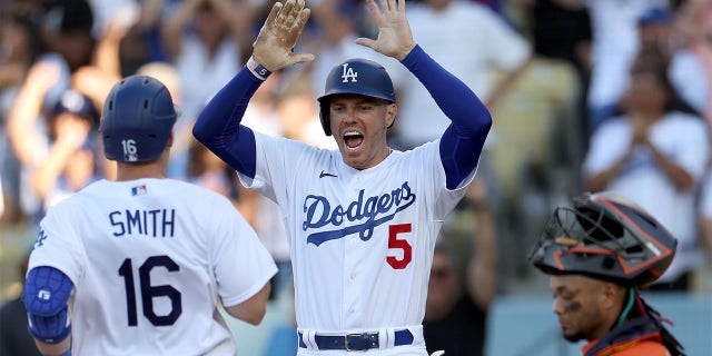 Freddie Freeman celebrates with Will Smith
