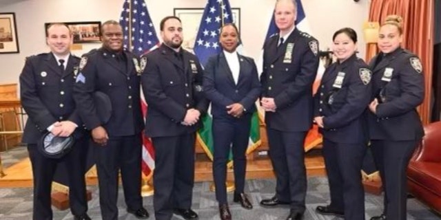 Clyde Jasmin, Ivan Nunez, Bonnie Wong and Jazmin Roman, along with their commanding officer, Billy Haut; NYPD Chief Michael Kemper; and Commissioner Keechant L. Sewell
