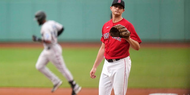Garrett Whitlock waits to receive new baseball