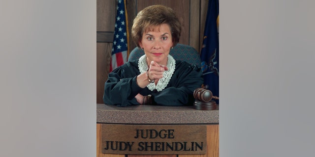 Judge Judy Sheindlin in her judge's robes on the set of Judge Judy
