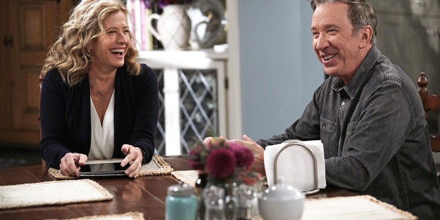 Nancy Travis and Tim Allen filming a scene for Last Man Standing