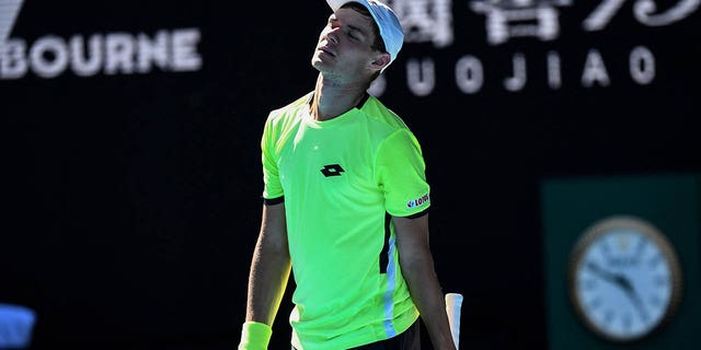 Kamil Majchrzak reacts to a point during the 2022 Australian Open