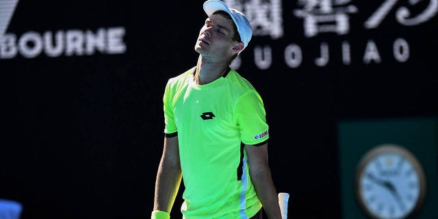 Kamil Majchrzak reacts to a point during the 2022 Australian Open