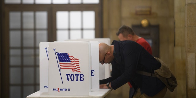 Voter fills out his mail-in ballot