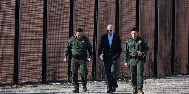 Biden walking with border officials