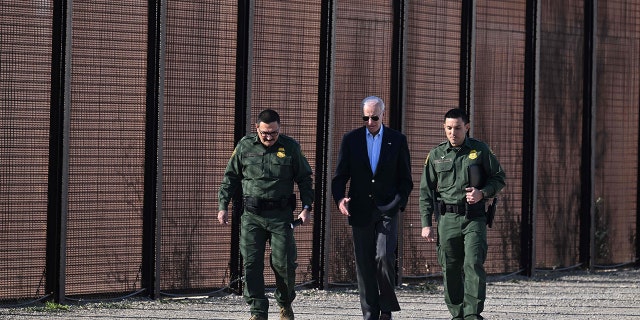 Biden walking with border officials