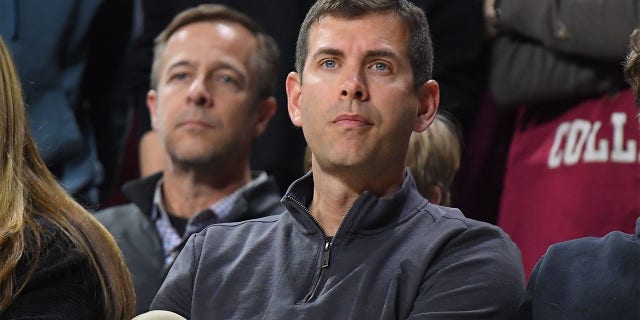 Brad Stevens watches a college basketball game