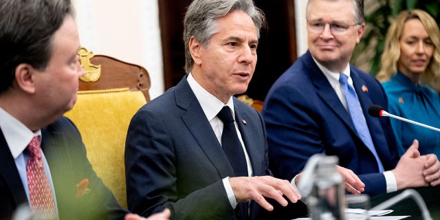 Blinken sits beside Daniel Kritenbrink