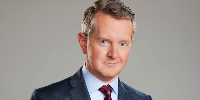 Ken Jennings poses for a photo in a suit