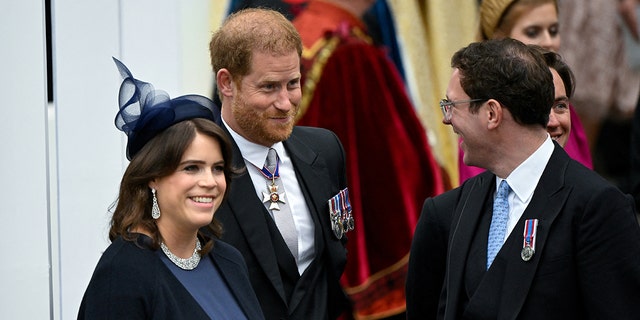 Prince Harry shares a laugh with Princess Eugenie and her husband Jack while at the Coronation of King Charles