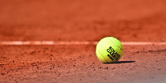 A tennis ball on the clay