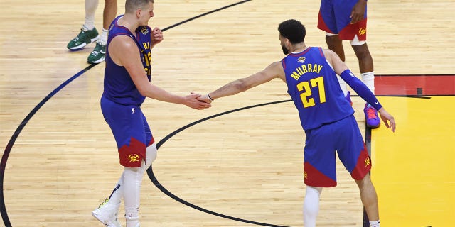 Nikola Jokic and Jamal Murray high five