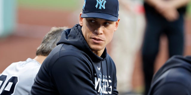 Aaron Judge looks on from the Yankees dugout
