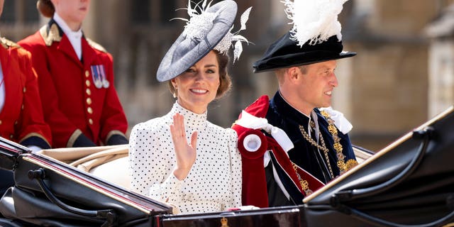 Kate Middleton and Prince William ride in a carriage wearing feathered hats