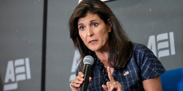 Haley speaks through a microphone at the American Enterprise Institute