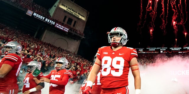 Zak Herbstreit walks onto the field