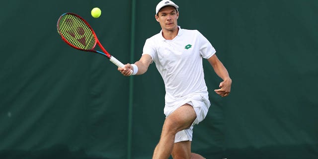 Kamil Majchrzak plays during Wimbledon in 2022