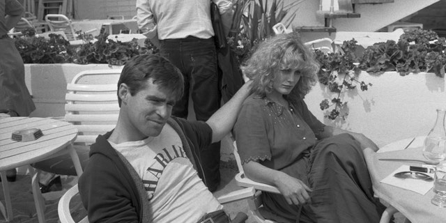 Black and white photo of Treat Williams and Beverly D'Angelo in Cannes