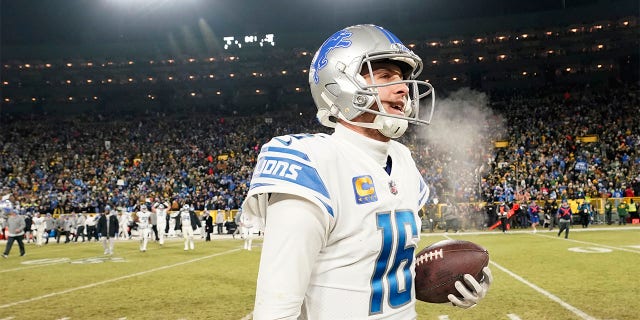 Jared Goff celebrates beating the Packers