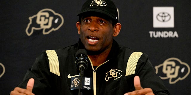 Deion Sanders speaks to the media