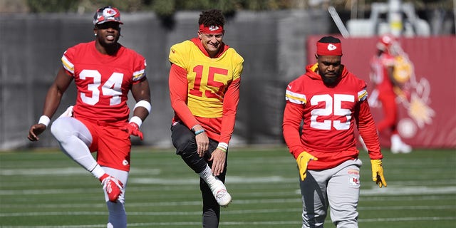 Melvin Gordon III on the practice field with Pat Mahomes