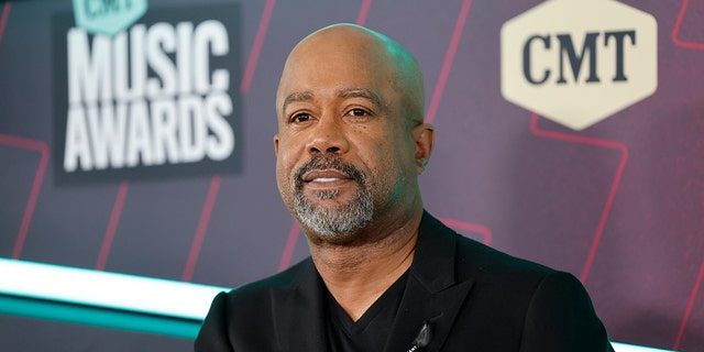 Darius Rucker in a black suit smiles at the CMT Music Awards in Austin