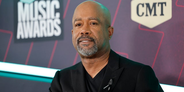 Darius Rucker in a black suit smiles at the CMT Music Awards in Austin