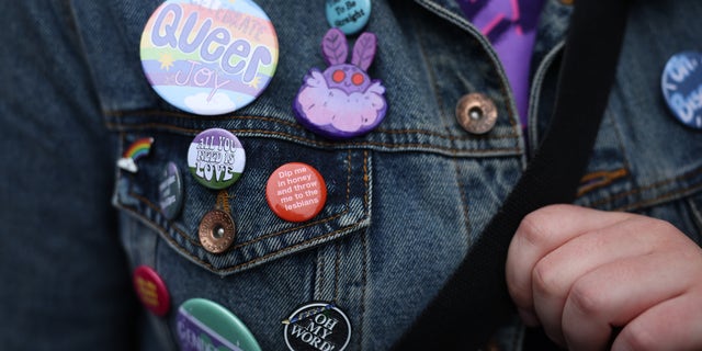 LGBTQ pins on a jacket