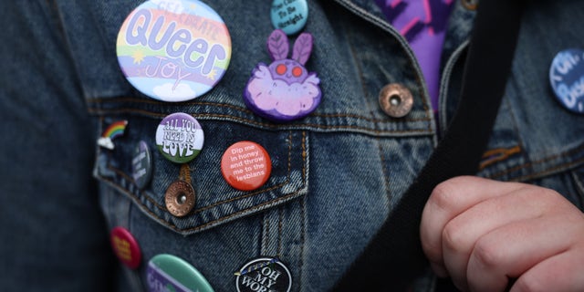 LGBTQ pins on a jacket