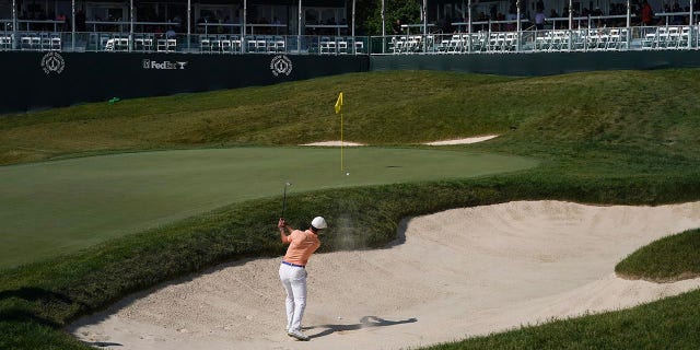 Billy Horschel plays a bunker shot