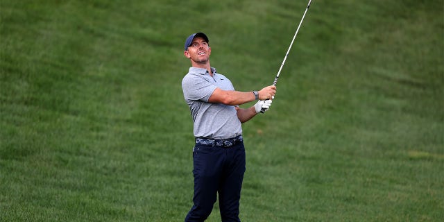 Rory McIlroy plays a shot during a practice round