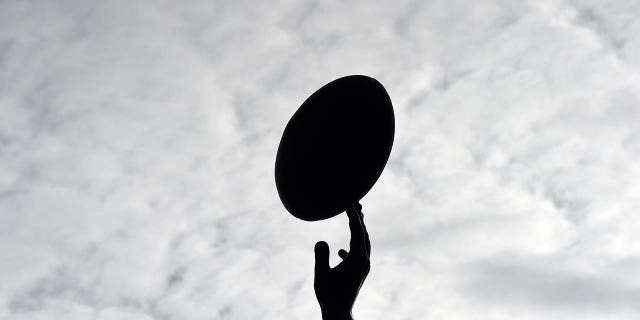 A Rugby player catches the ball