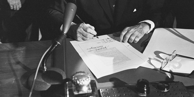 Hands after signing the Civil Rights Act of 1964