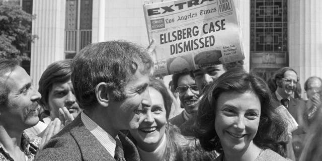 Ellsberg smiling with wife