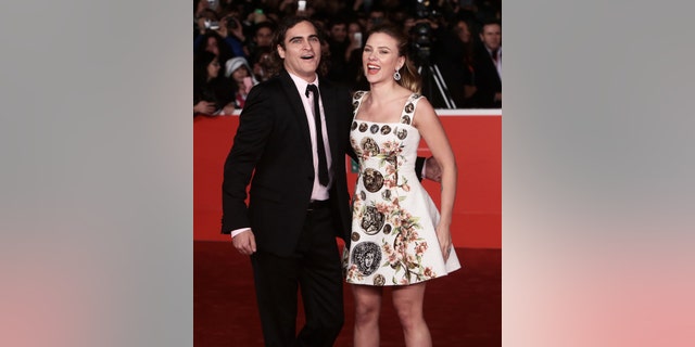 Joaquin Phoenix and Scarlett Johansson laugh on the red carpet for the premiere of "Her" in Rome