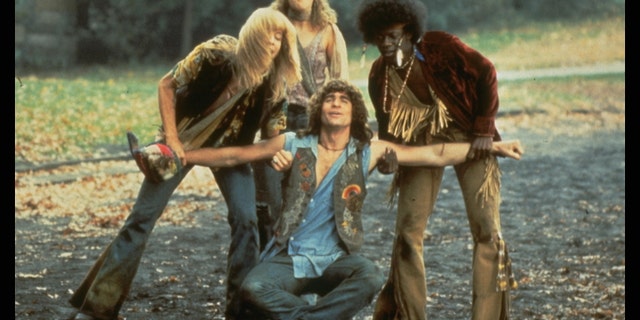 Treat Williams, seated, in a scene from Hair