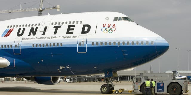 united airlines plane on runway